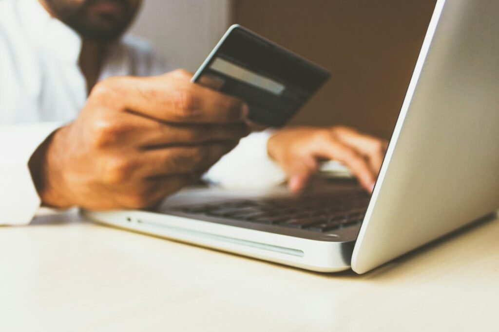 Laptop and payment card ready for online shopping checkout